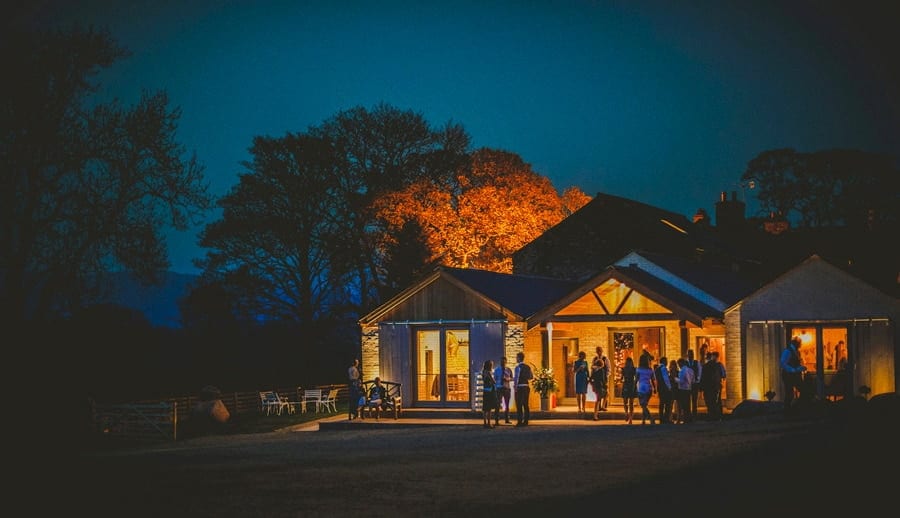 Wedding guests outside Eden Barn in Little Musgrave