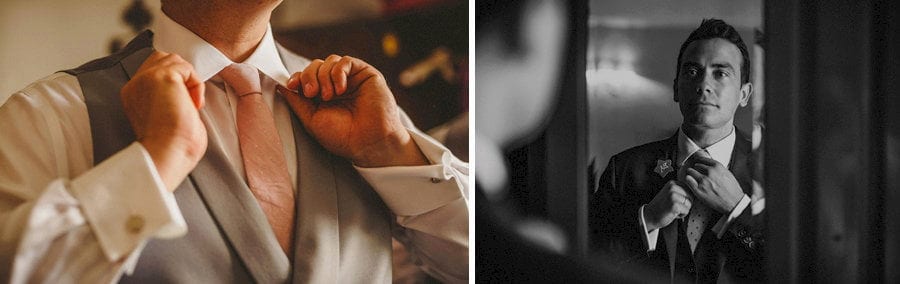 The best man looks into a mirror in the hotel room