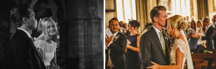 The groom kisses his bride on the forehead during the wedding ceremony
