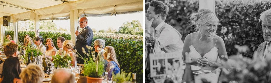 The grooms father delivers his speech in the marquee