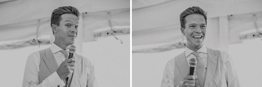 The groom stands up in the marquee and delivers his speech to the wedding party