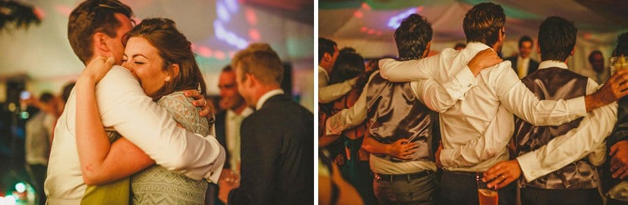 The ushers embrace each other on the dancefloor