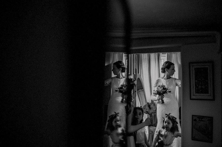 The bride and a flowergirl leave the bridal suite at Voewood