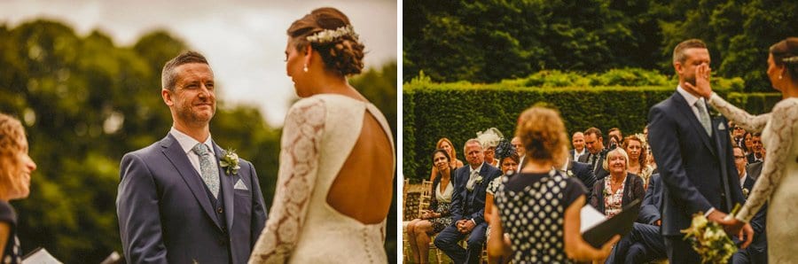 The bride and groom face each other during the wedding ceremony