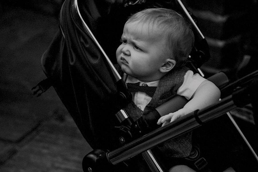 A child sat in a pram