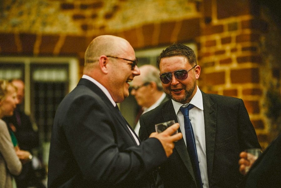 Wedding guests talk with one another