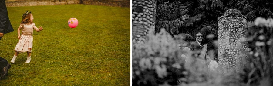 A flower girl kicks a football towards her father on the lawn at Voewood