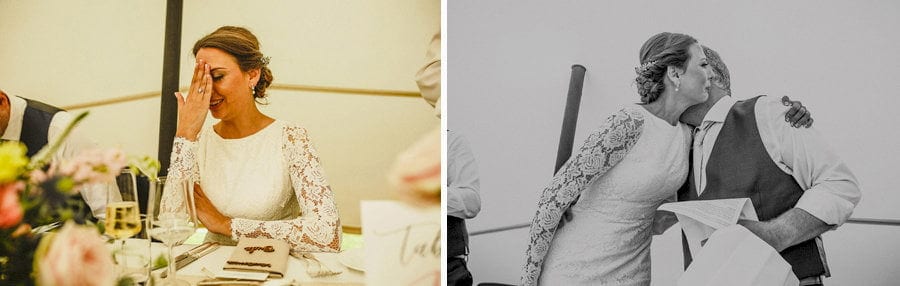 The bride places her hand on her face as she listens to her fathers speech