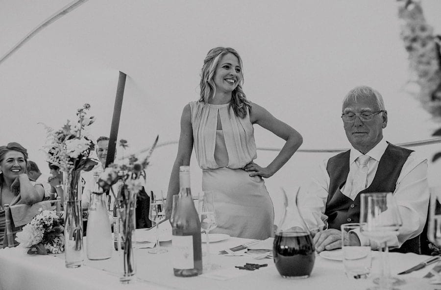 One of the bridesmaids delivers her speech to the wedding guests in the marquee