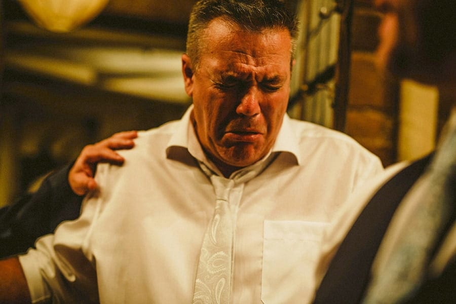 An usher inhales smoke from a cigar