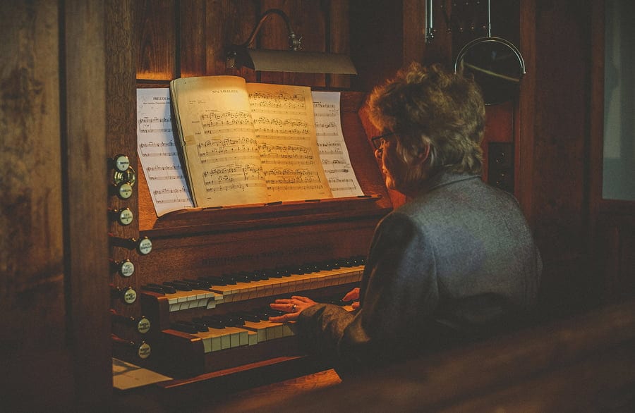 The church pianist plays on the organ