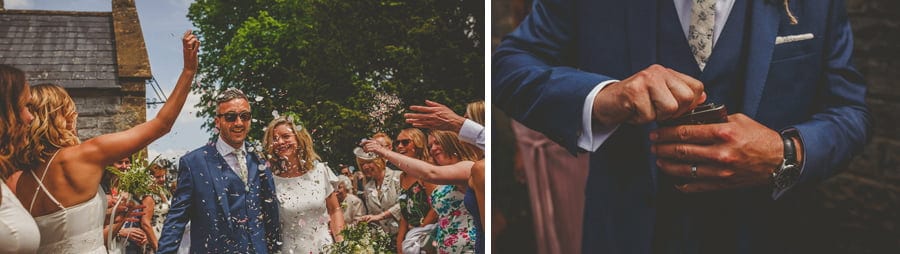 Confetti is thrown onto the bride and groom as they leave the church