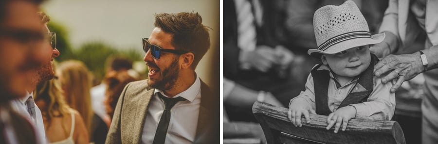 Wedding guests laugh and chat with each other