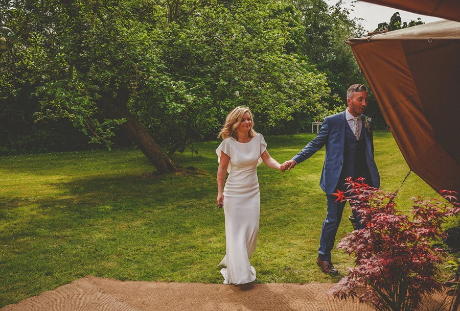 The bride and groom enter the tipi
