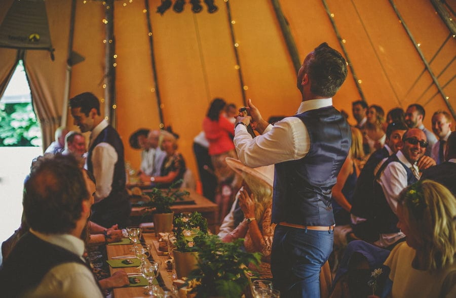 The cork explodes out of the bottle in the tipi to start the celebrations
