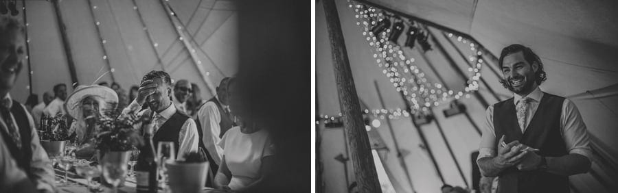 The groom holds a hand to his head as the best man delivers his speech