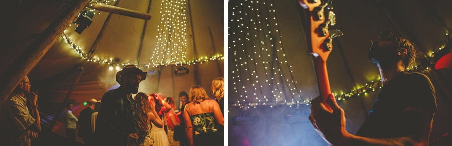 The guitarist of the wedding band on stage performing in the tipi