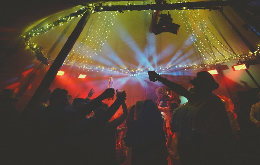 The wedding party celebrate the end of the wedding day