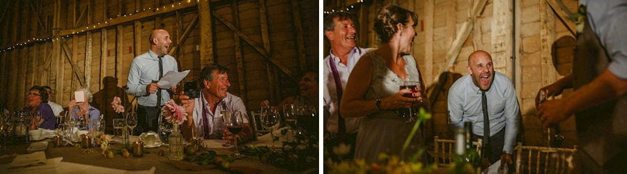 The best man delivers his speech to the wedding party in the old barn