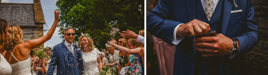 Confetti is thrown onto the bride and groom as they leave the church