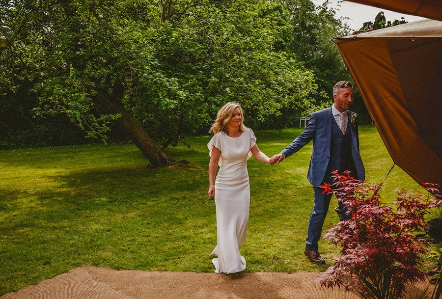 The bride and groom enter the tipi