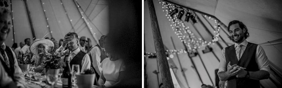 The groom holds a hand to his head as the best man delivers his speech