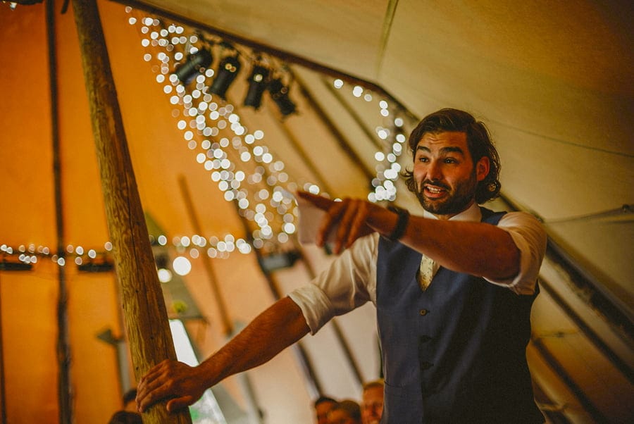 The best man delivers his speech in the tipi