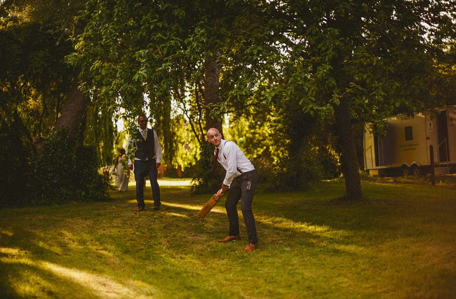The ushers playing cricket in the back garden