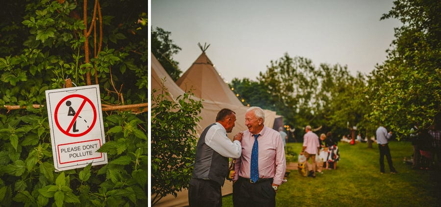Wedding guests share a joke in the garden