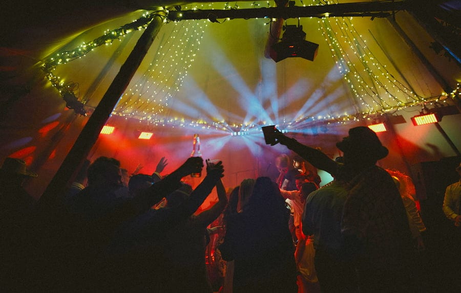 The wedding party celebrate the end of the wedding day