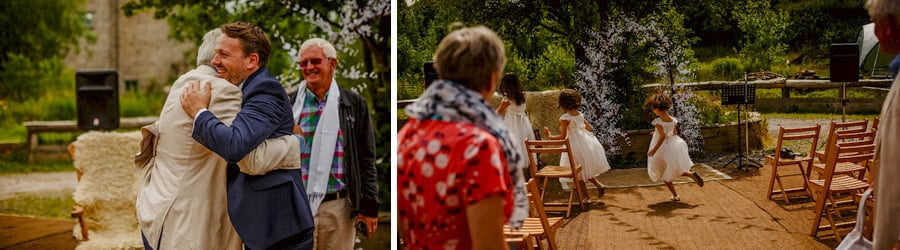 The groom greets his family in the courtyard at Fernhill Farm