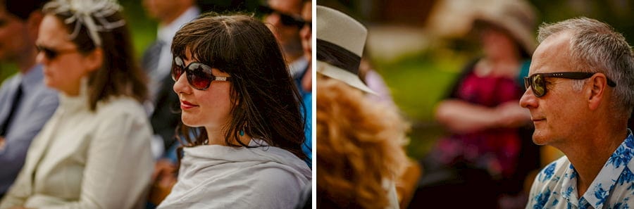 Wedding guests sit and watch the outdoor wedding ceremony at Fernhill Farm