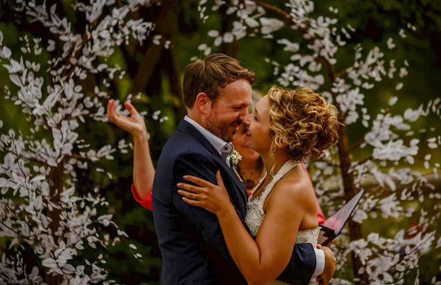 The bride and groom hold each other