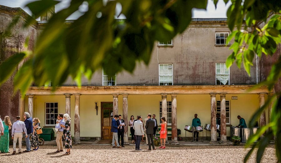 Guests gather outside at Pennard house, Somerset